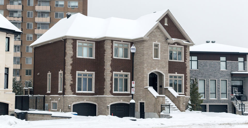 Ottawa residential street in late autumn showing typical 1980s homes with renovation activity signs